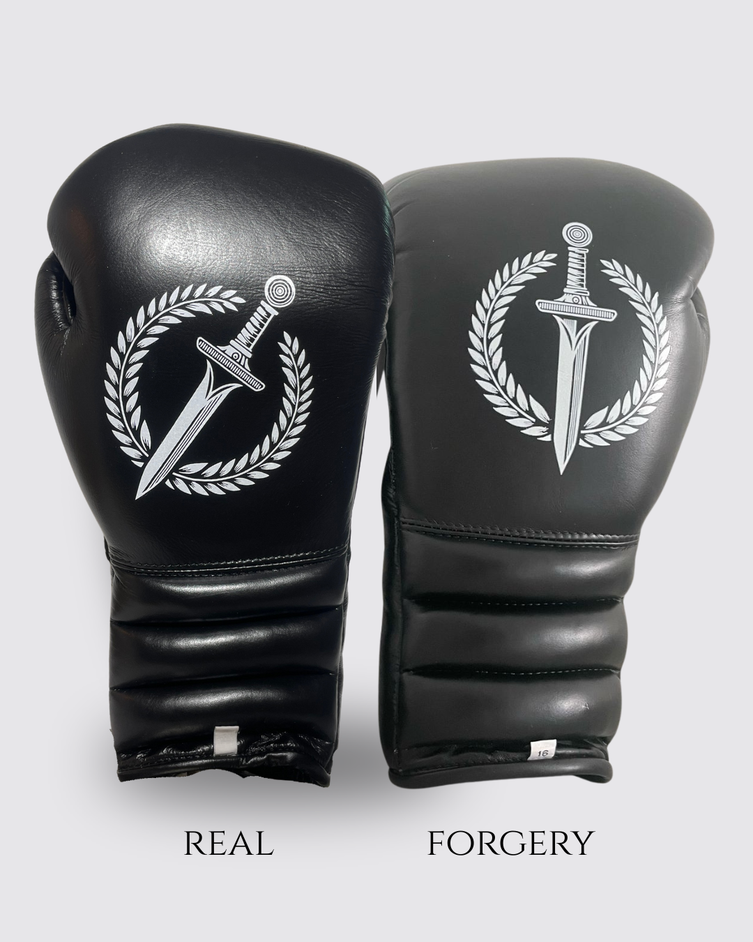 Black boxing gloves with a sword and laurel wreath design, labeled 'Real' and 'Forgery' side by side.