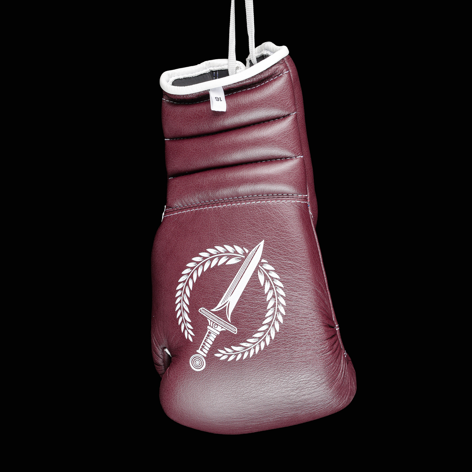 Burgundy boxing glove with a white logo on a black background.