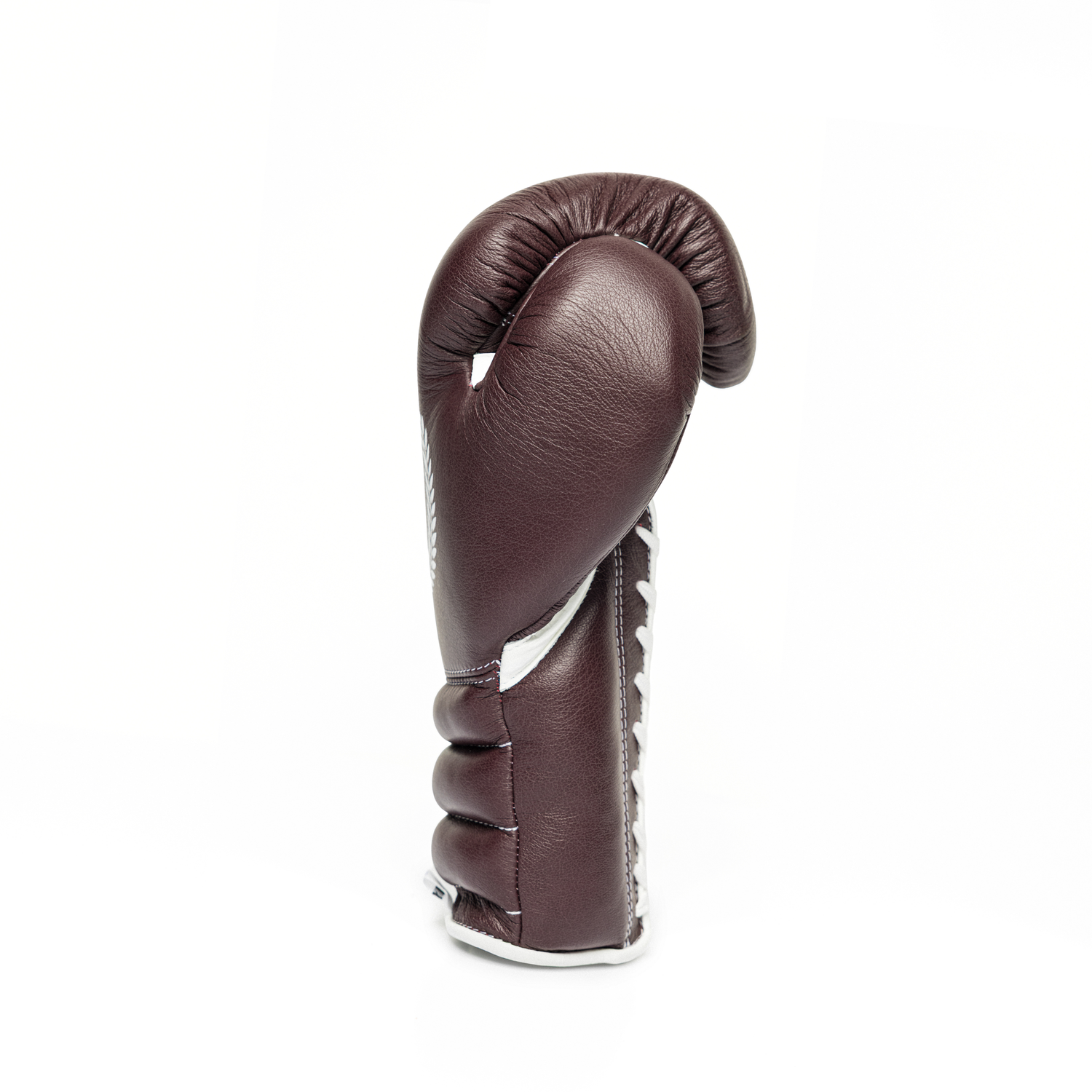 Sideway profile of a burgundy lace-up boxing glove on a white background.