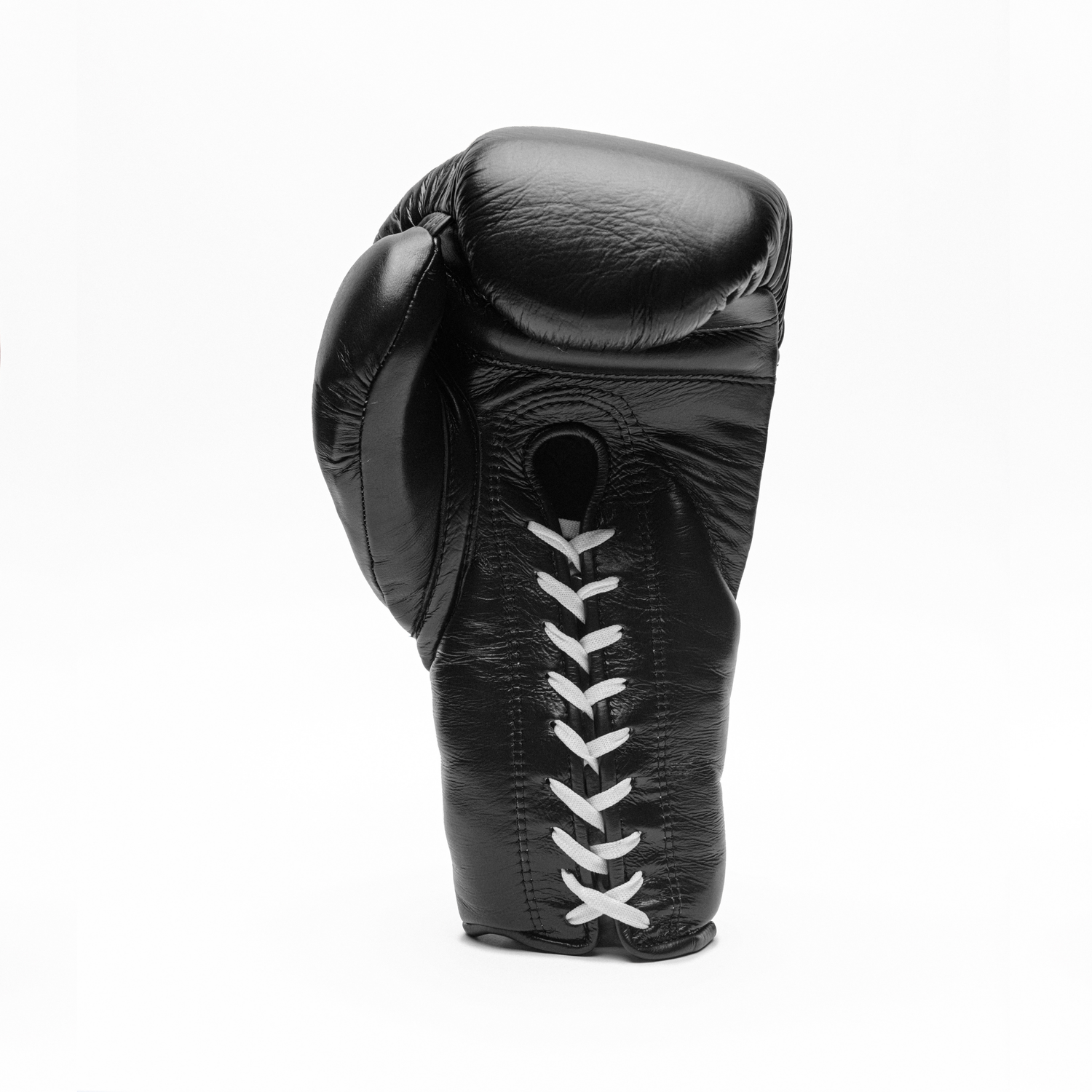 Black boxing glove with white stitching on a white background.