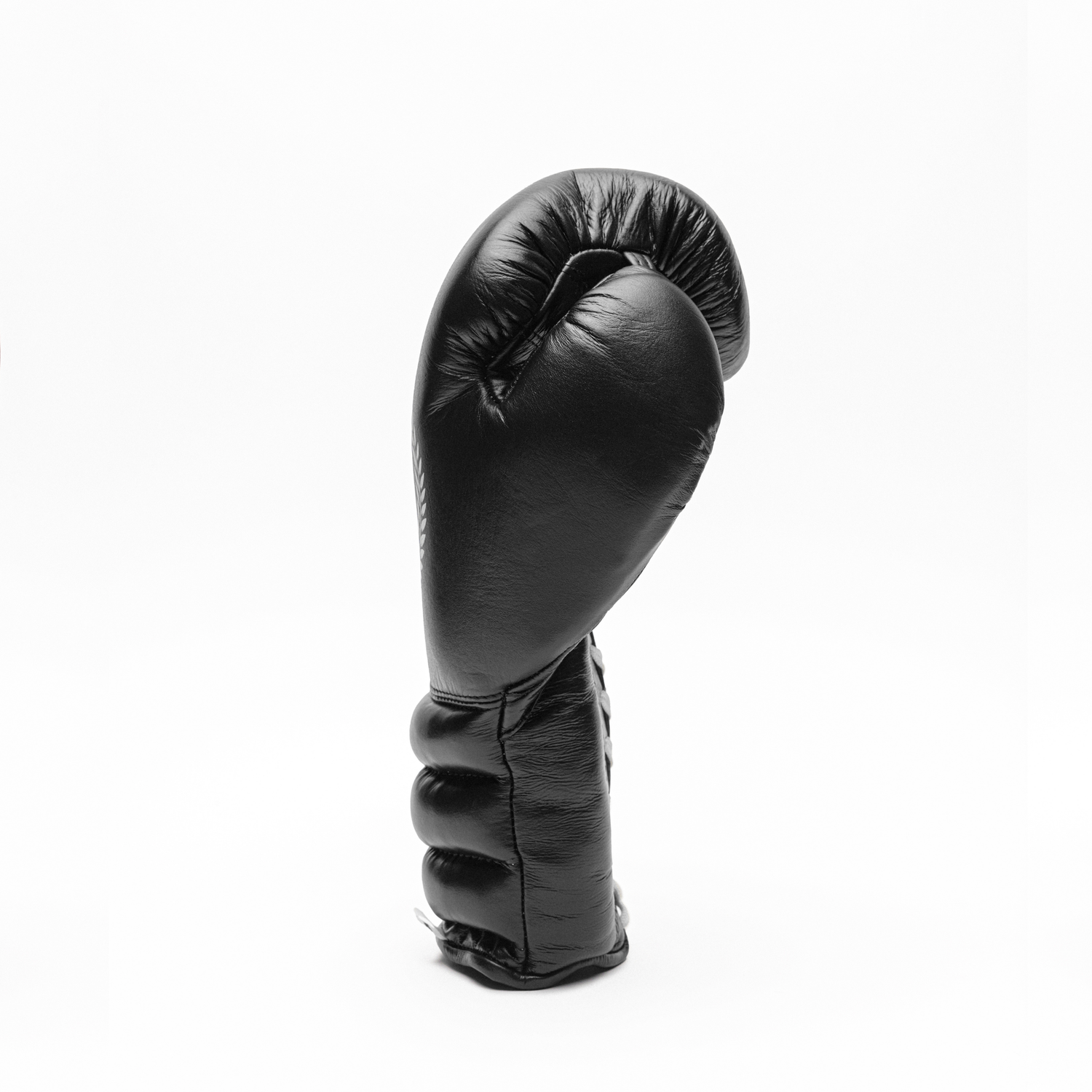 Black boxing glove on a white background.