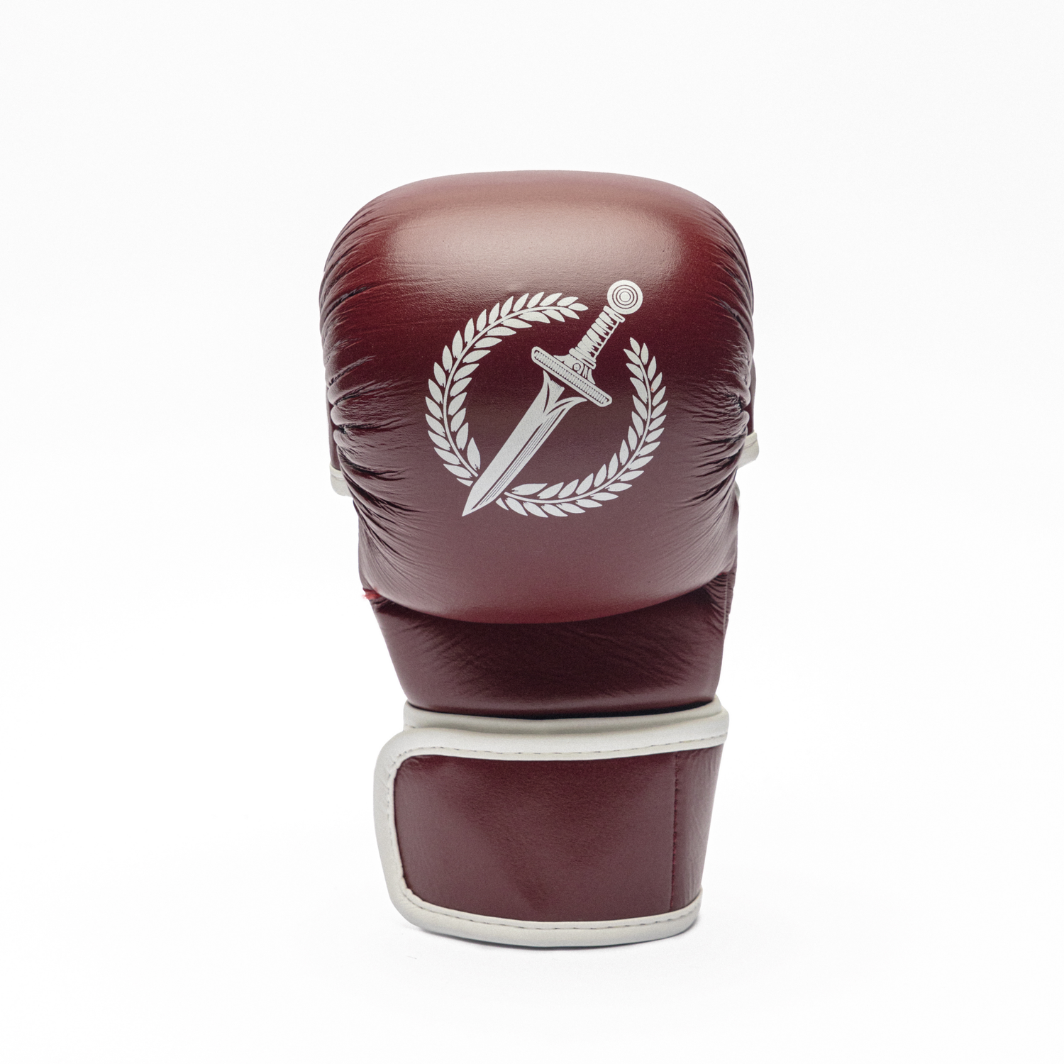 Maroon MMA glove with a white emblem on a white background.