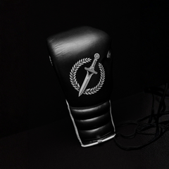 Black and white boxing glove on a black background.