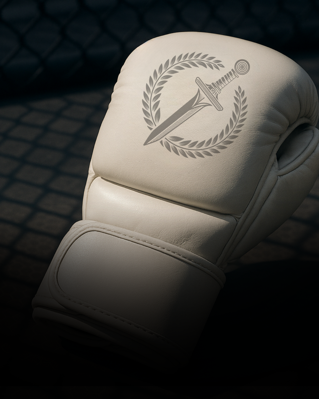 White MMA glove with a logo on a dark background.