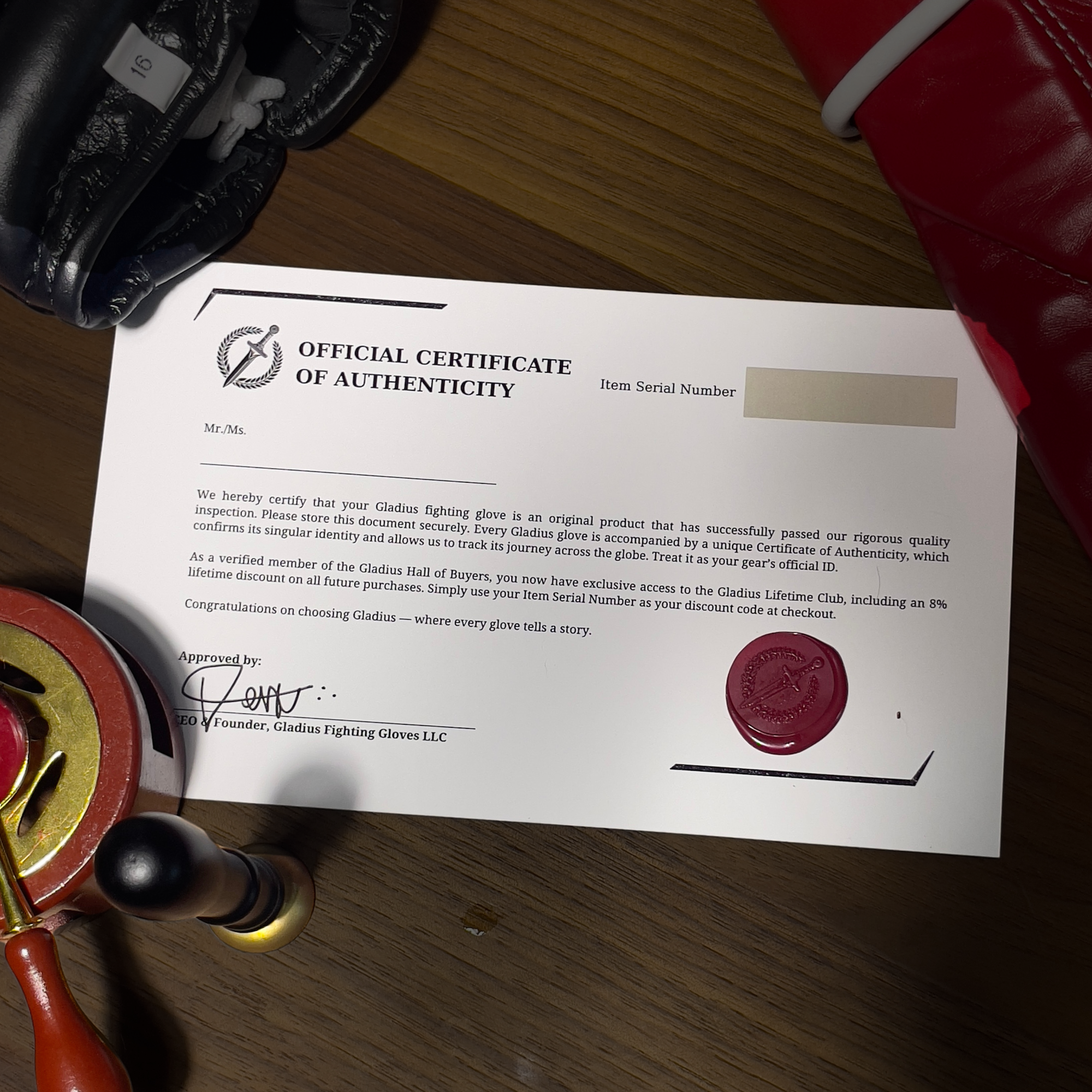 Official Certificate of Authenticity with a red wax seal on a wooden surface.