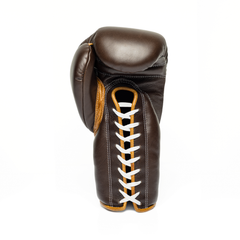 Brown boxing glove with white laces on a white background.