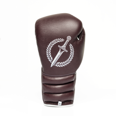 Brown boxing glove with a white logo on a white background.