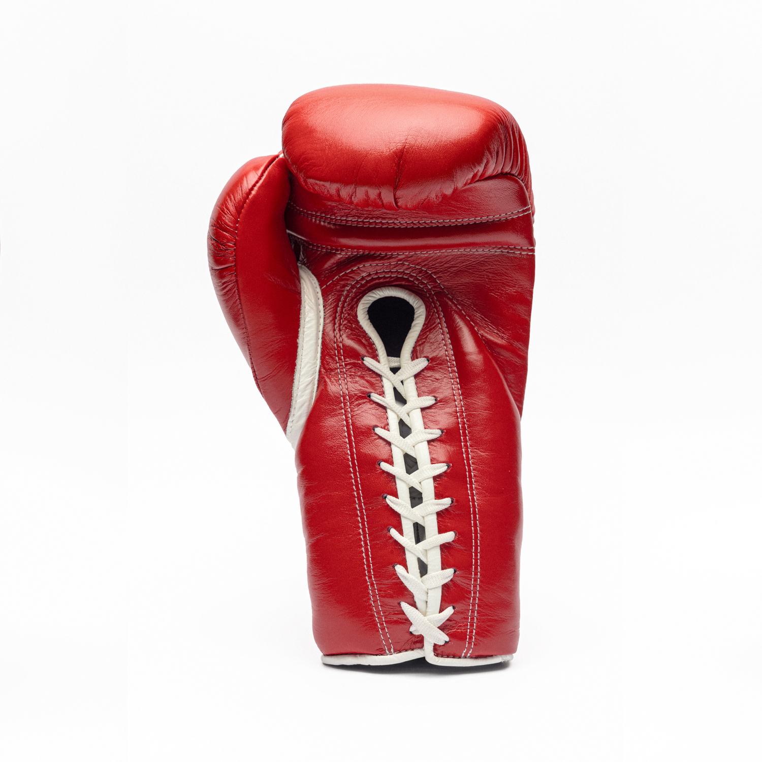 Red boxing glove with white laces on a white background.