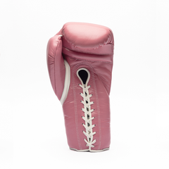 Pink boxing glove with white laces on a white background.
