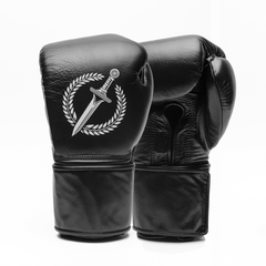 Black boxing gloves with a white logo on a white background.