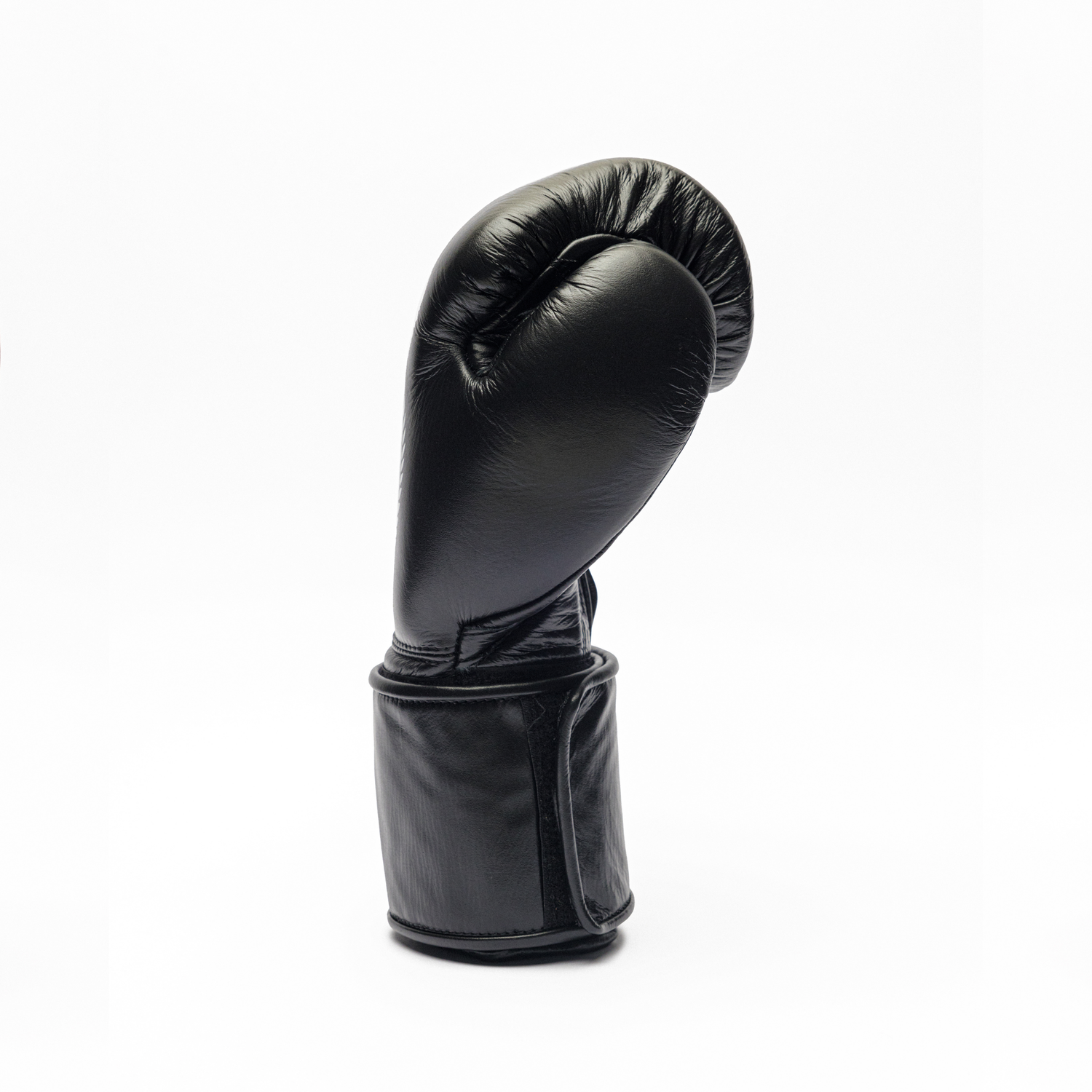 Black boxing glove on a white background.