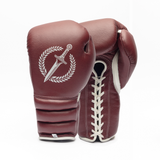 Pair of maroon boxing gloves with a white emblem on a white background.