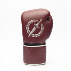 Maroon boxing glove with a logo on a white background.