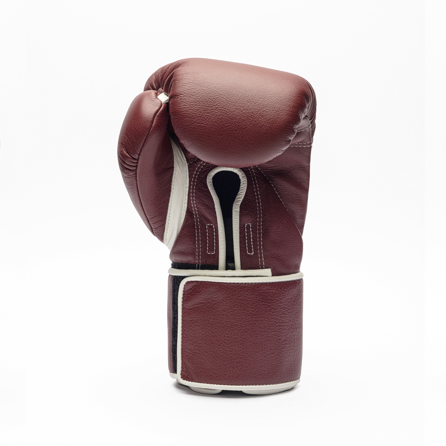 Maroon boxing glove with white accents on a white background.
