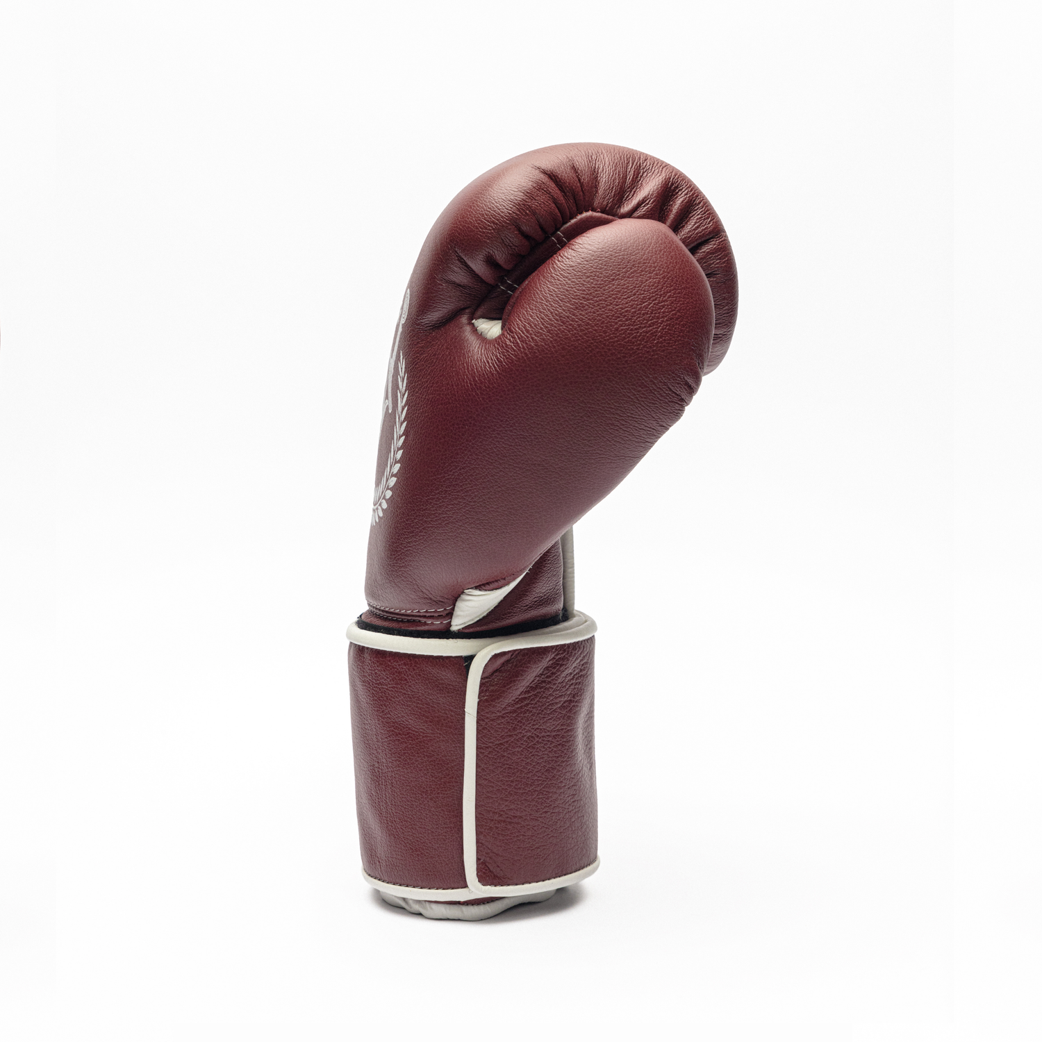 Maroon boxing glove on a white background.