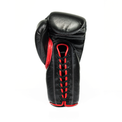Black and red lace-up boxing glove on a white background.