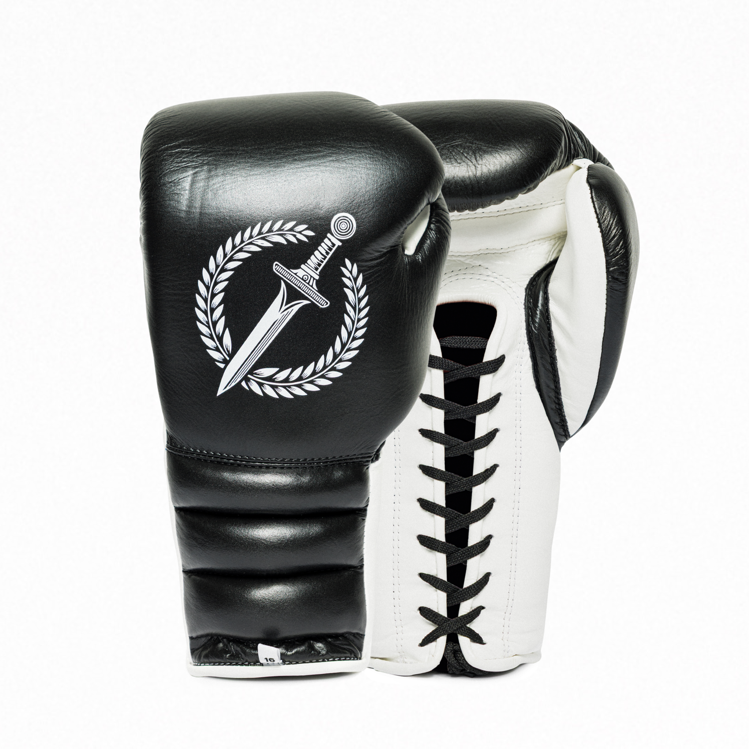 A pair of Gladius Obsidian black and white boxing gloves on a white background.